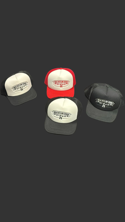 New Outlaw Denim LLC trucker hats in red, black, and white with Get Up & Go embroidery on a dark bedspread.